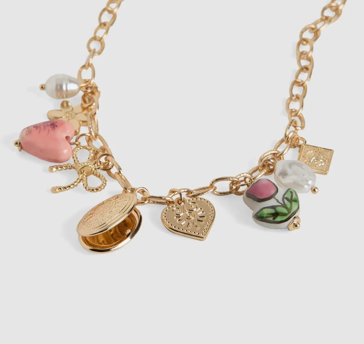 THE CHARMING BLOSSOM LOCKET NECKLACE